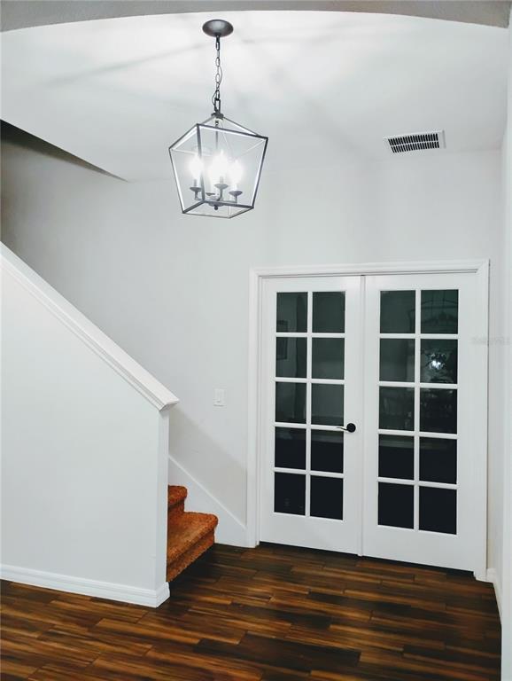 5107 Autumn Ridge Drive Wesley Chapel, FL 33545 - Photo 12 of 35 a view of empty room with wooden floor and window