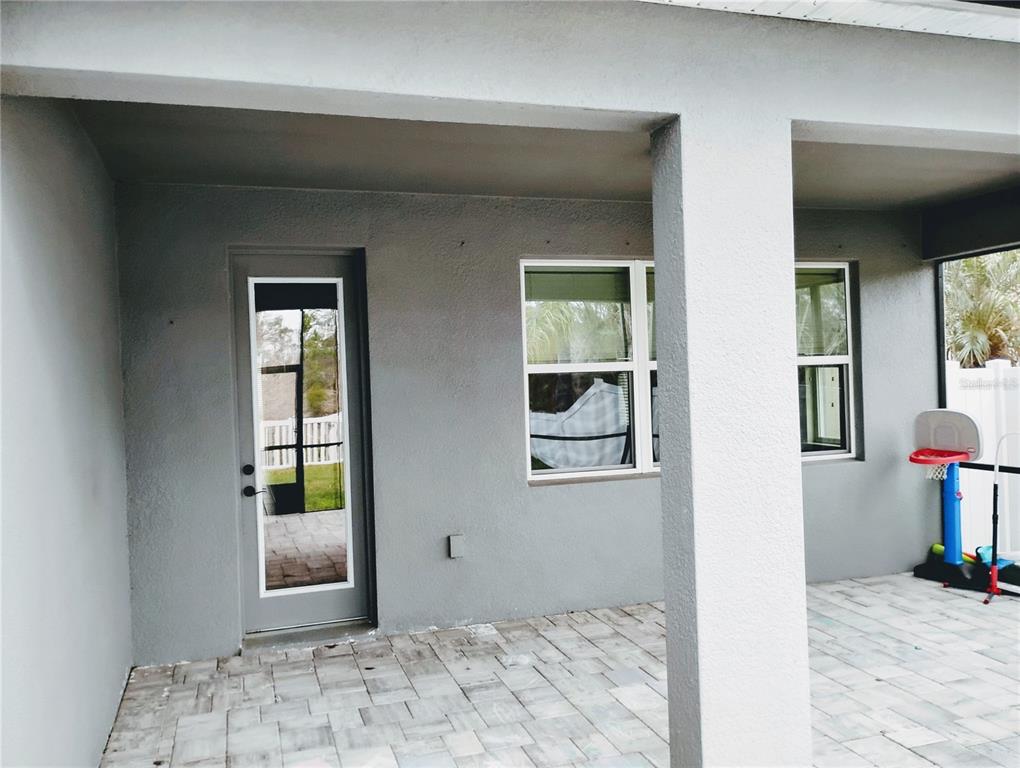 5107 Autumn Ridge Drive Wesley Chapel, FL 33545 - Photo 28 of 35 a view of a hallway with wooden floor and a livingroom