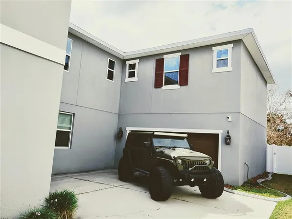 a large kitchen with a table and chairs