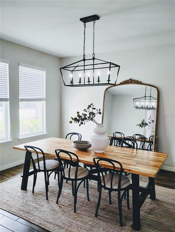 5107 Autumn Ridge Drive Wesley Chapel, FL 33545 - Photo 10 of 35 a view of a dining room with furniture and chandelier