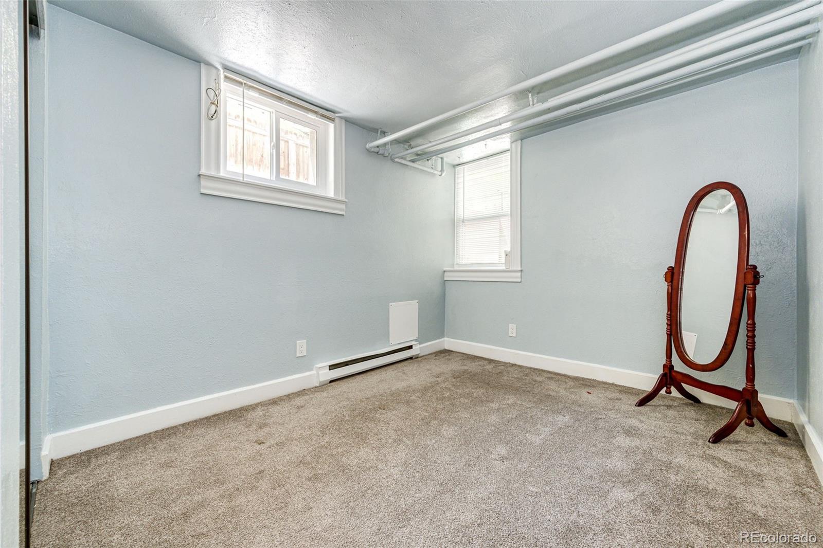 1401 Fillmore Street, Unit 5 Denver, CO 80206 - Photo 11 of 19 an empty room with windows