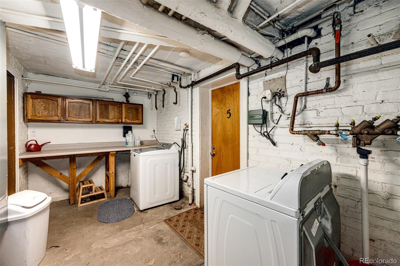 1401 Fillmore Street, Unit 5 Denver, CO 80206 - Photo 14 of 19 a utility room with dryer and washer