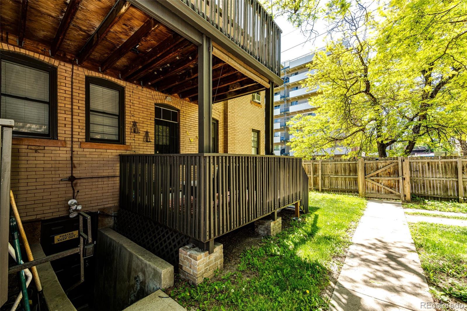 1401 Fillmore Street, Unit 5 Denver, CO 80206 - Photo 15 of 19 a view of a backyard with a small cabin