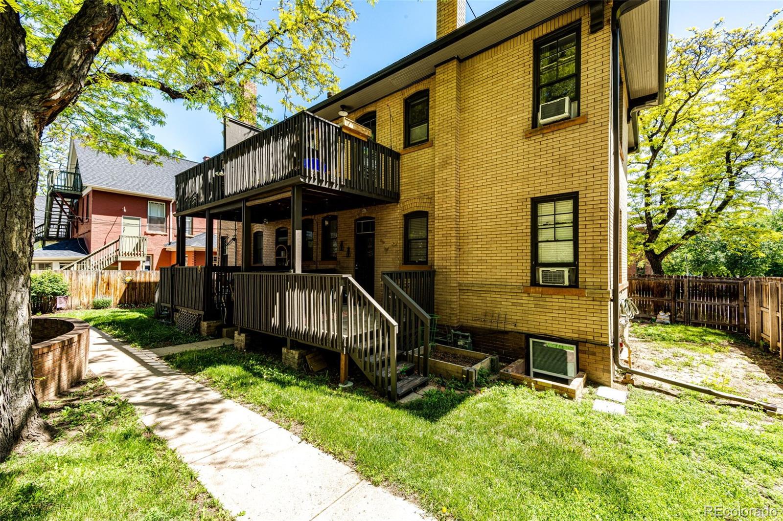 1401 Fillmore Street, Unit 5 Denver, CO 80206 - Photo 17 of 19 a view of house with a yard
