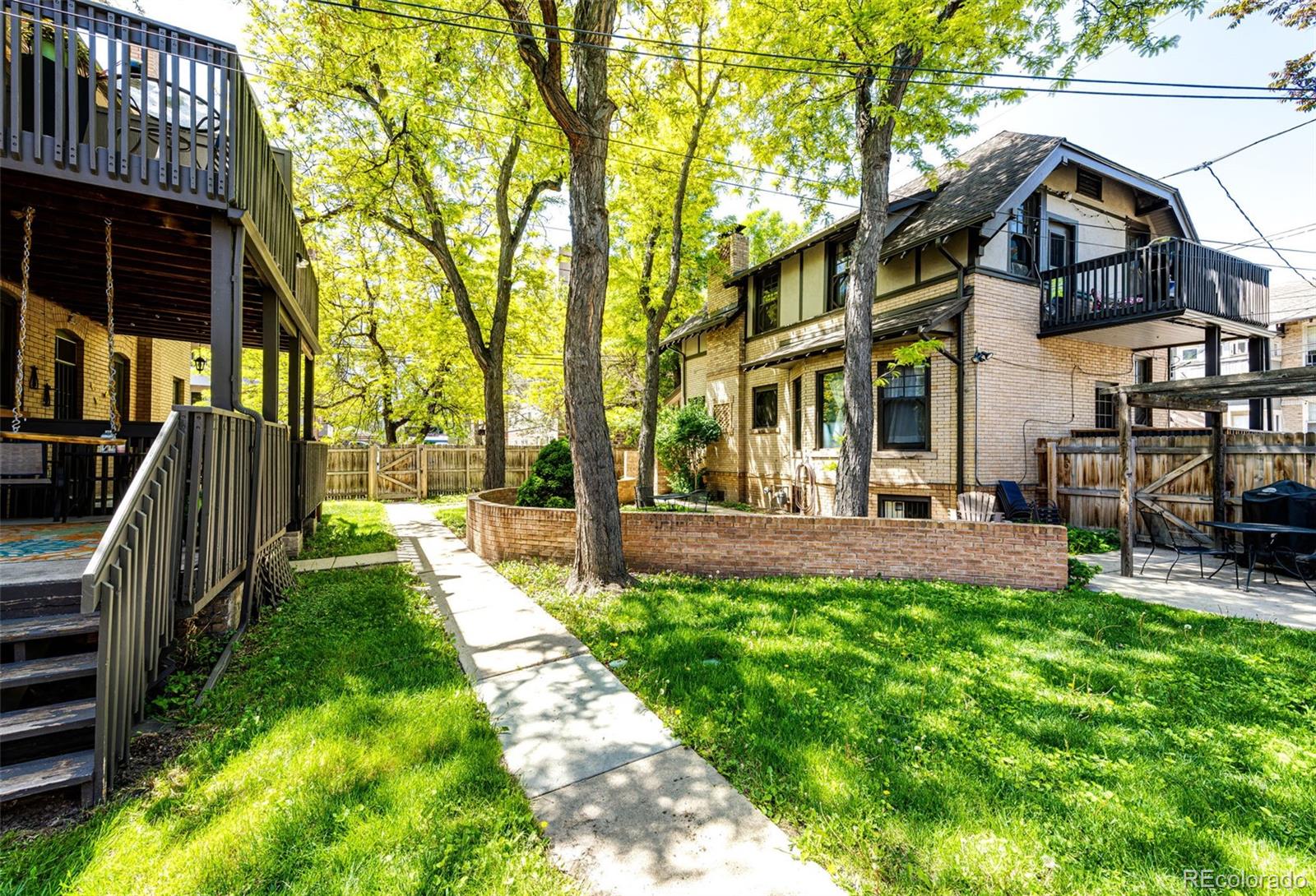 1401 Fillmore Street, Unit 5 Denver, CO 80206 - Photo 18 of 19 a view of a building with a yard