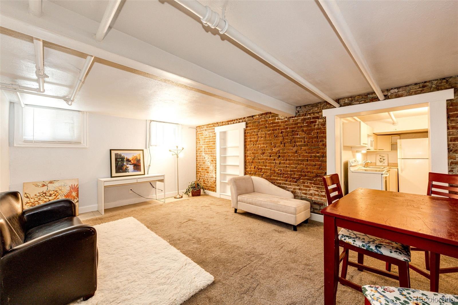 1401 Fillmore Street, Unit 5 Denver, CO 80206 - Photo 6 of 19 a bedroom with furniture and a large window