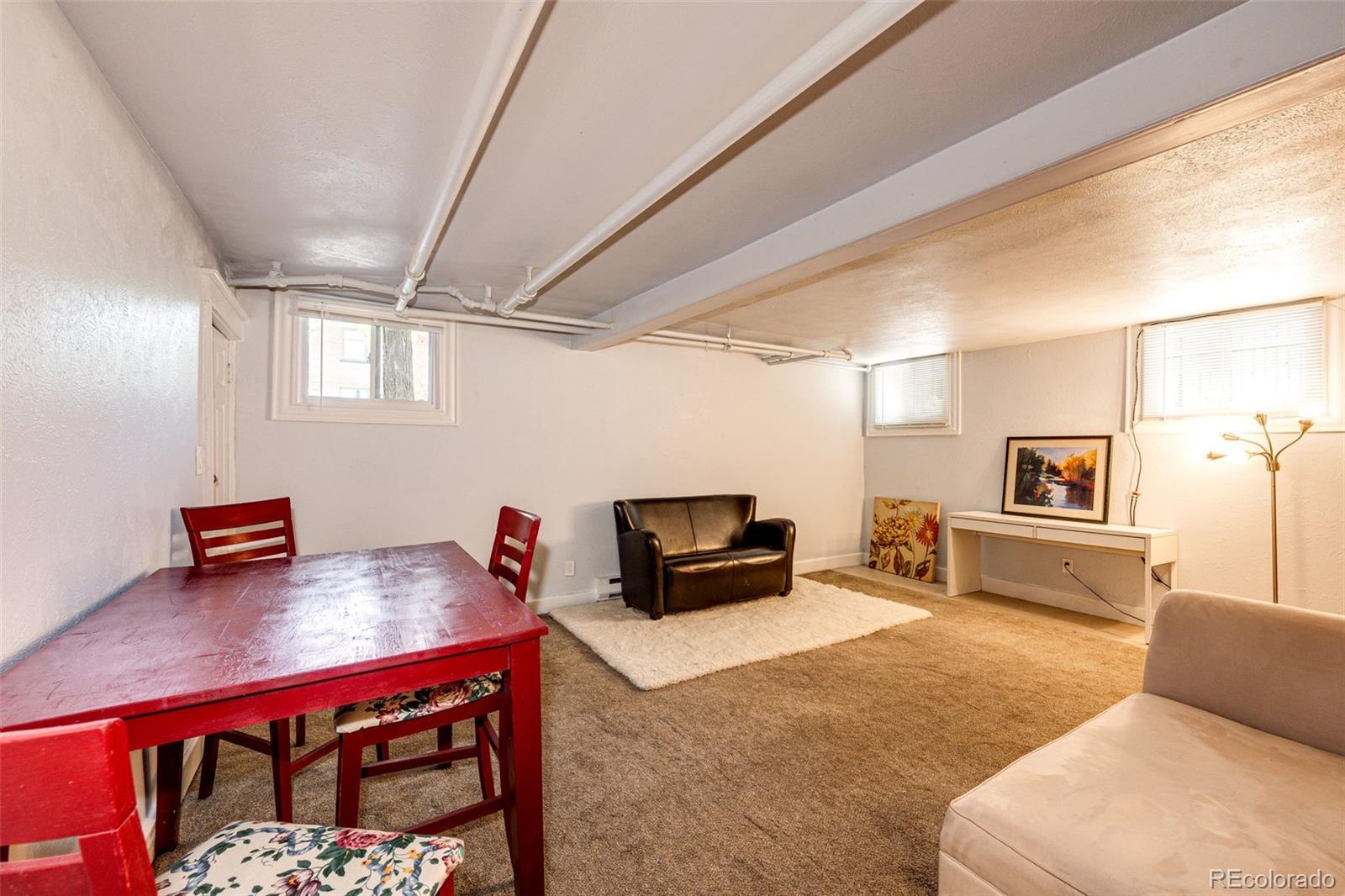 1401 Fillmore Street, Unit 5 Denver, CO 80206 - Photo 7 of 19 a living room with furniture and a flat screen tv