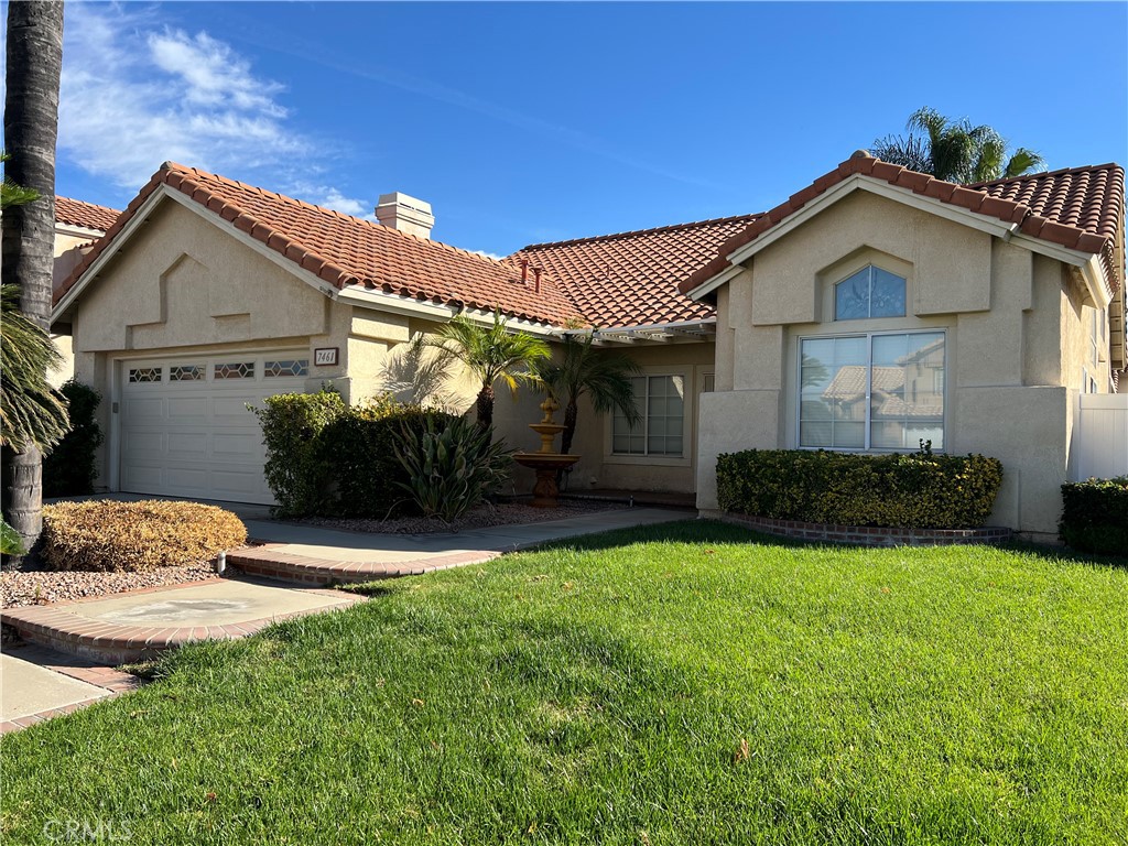 7461 Red Clover Way Highland, CA 92346 - Photo 1 of 35 a front view of a house with a yard
