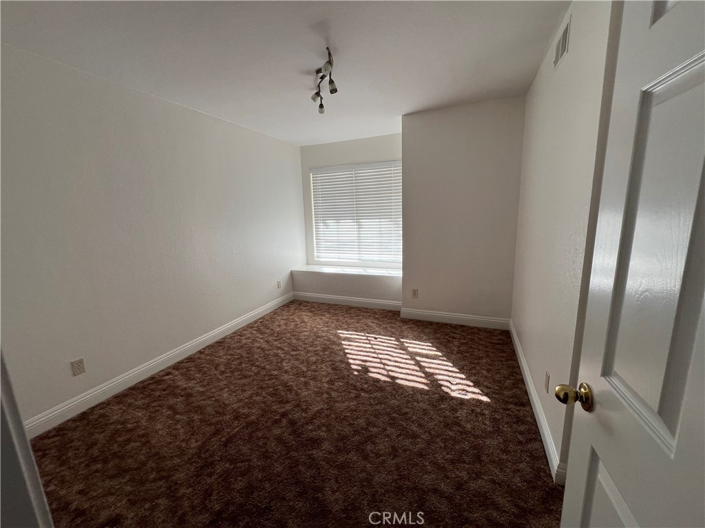 7461 Red Clover Way Highland, CA 92346 - Photo 20 of 35 a view of empty room with window
