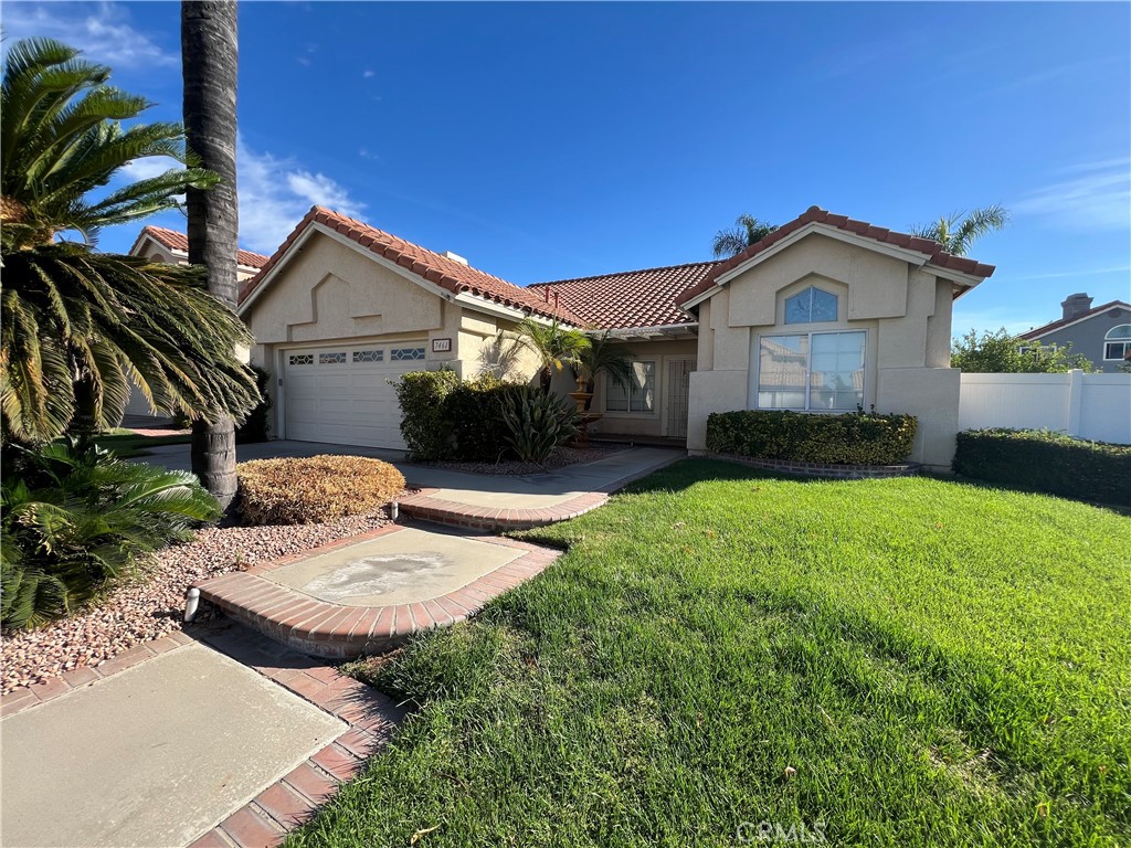 7461 Red Clover Way Highland, CA 92346 - Photo 2 of 35 a front view of a house with garden