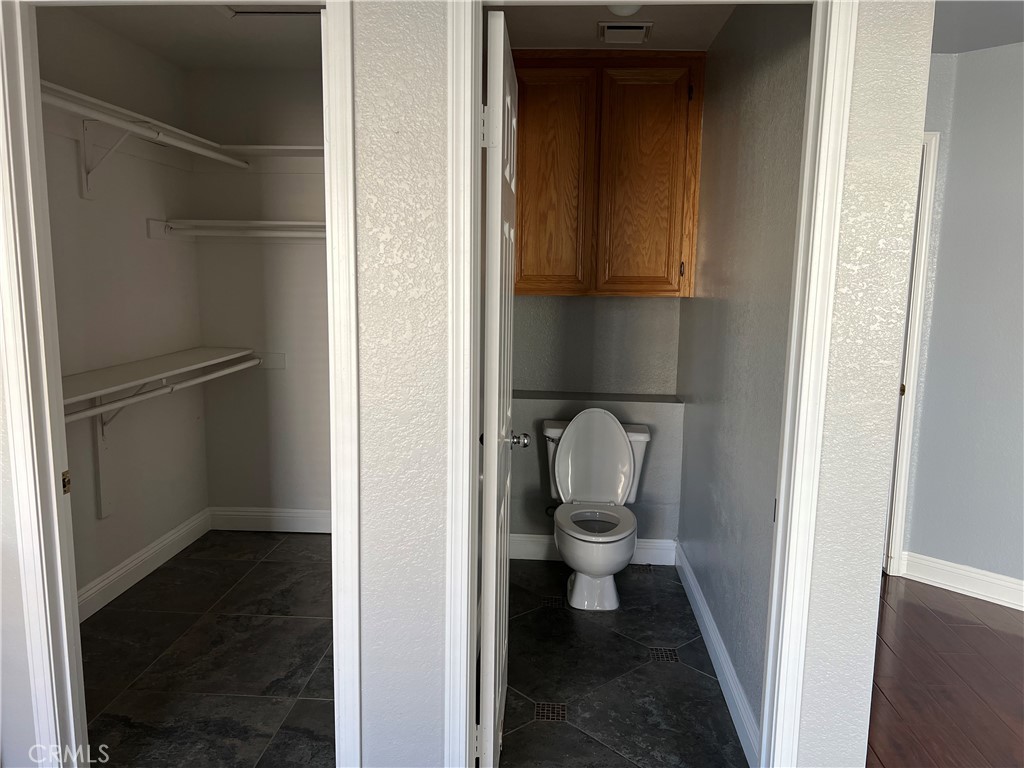 7461 Red Clover Way Highland, CA 92346 - Photo 24 of 35 a bathroom with a toilet and a sink