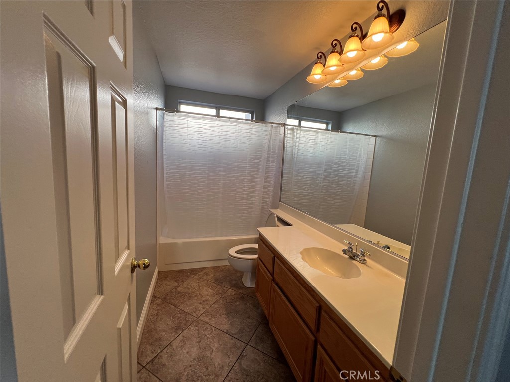 7461 Red Clover Way Highland, CA 92346 - Photo 26 of 35 a bathroom with a sink and mirror