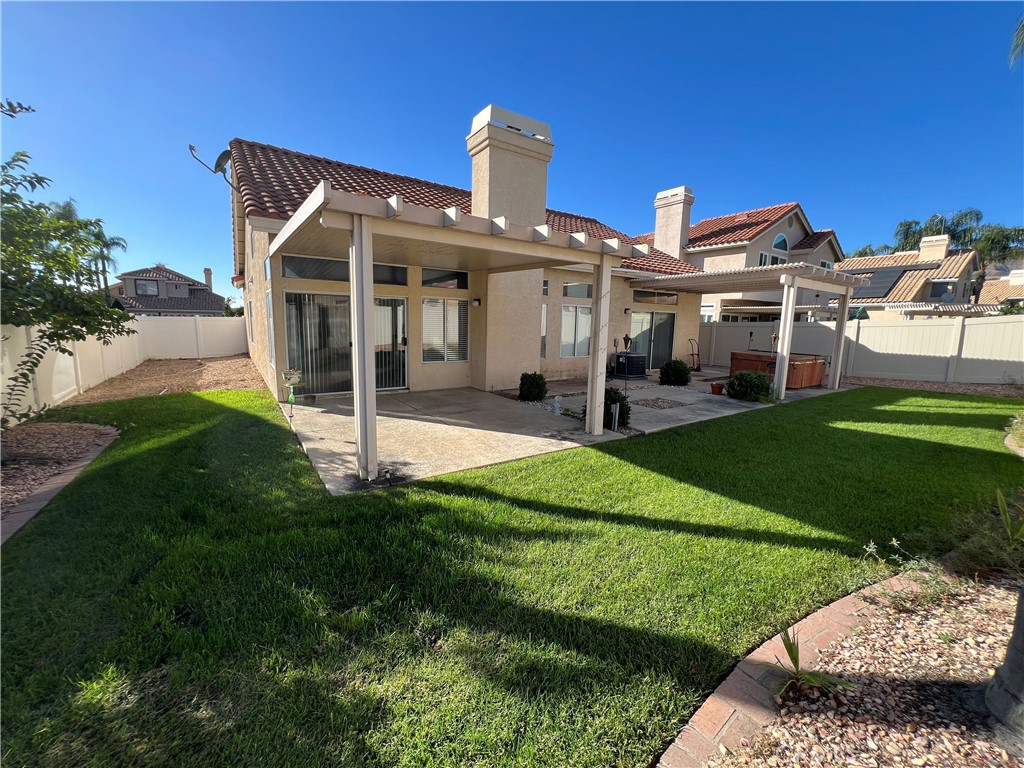7461 Red Clover Way Highland, CA 92346 - Photo 29 of 35 a front view of a house with a yard