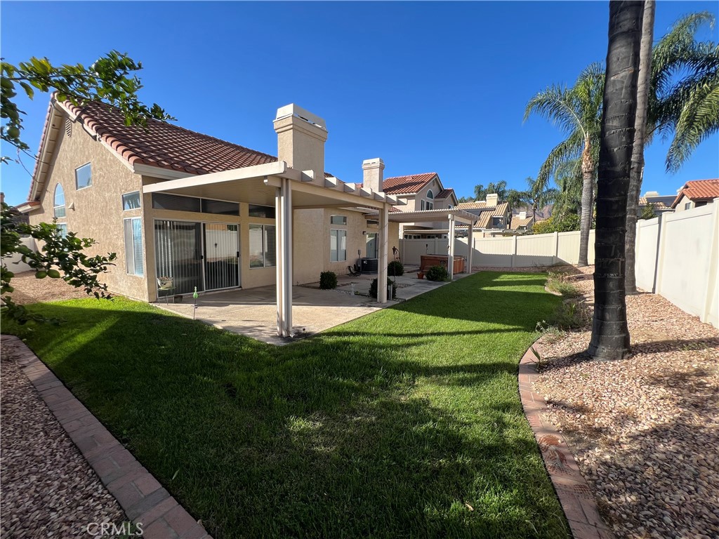 7461 Red Clover Way Highland, CA 92346 - Photo 30 of 35 a view of a house with a yard and a garden