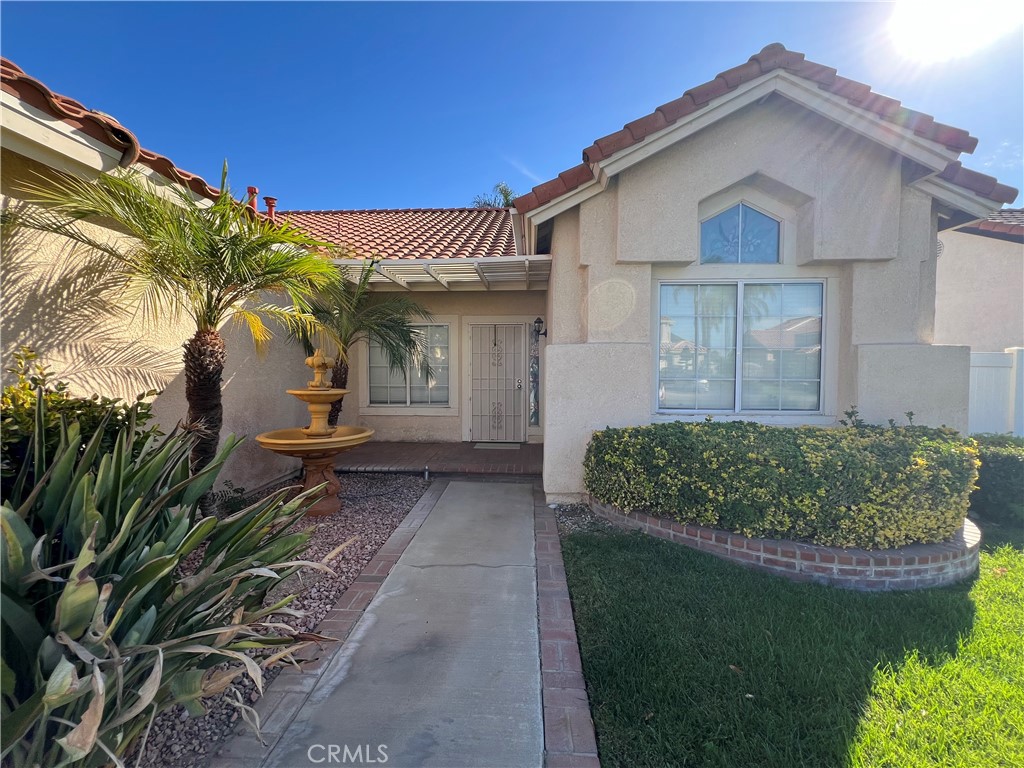 7461 Red Clover Way Highland, CA 92346 - Photo 3 of 35 a front view of a house with a yard