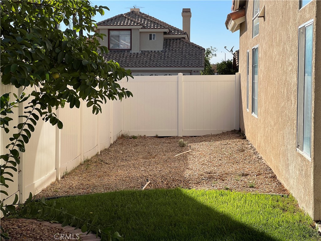 7461 Red Clover Way Highland, CA 92346 - Photo 32 of 35 a front view of a house with a yard