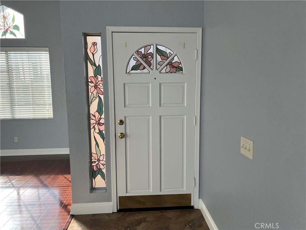 7461 Red Clover Way Highland, CA 92346 - Photo 7 of 35 a view of an entryway with wooden floor