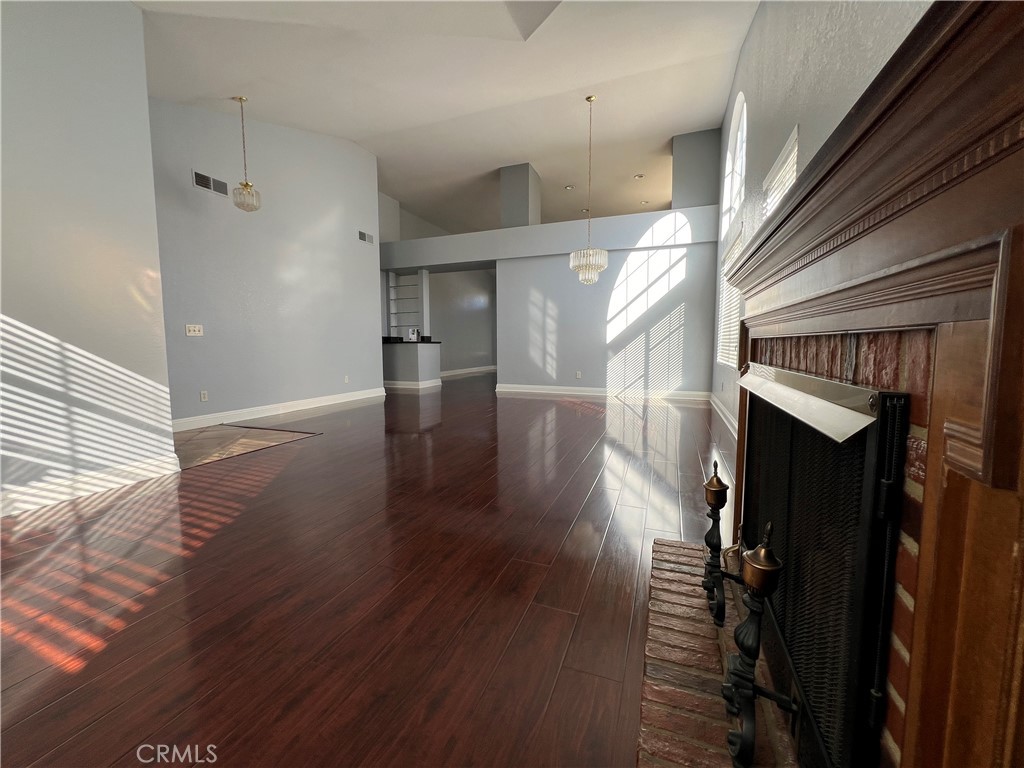 7461 Red Clover Way Highland, CA 92346 - Photo 9 of 35 a view of hallway with wooden floor