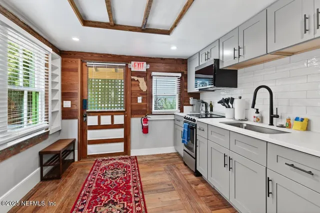 a bed room with a bed and a television