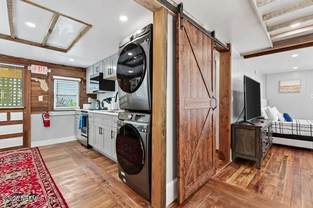 a view of a chair and tables in the backyard
