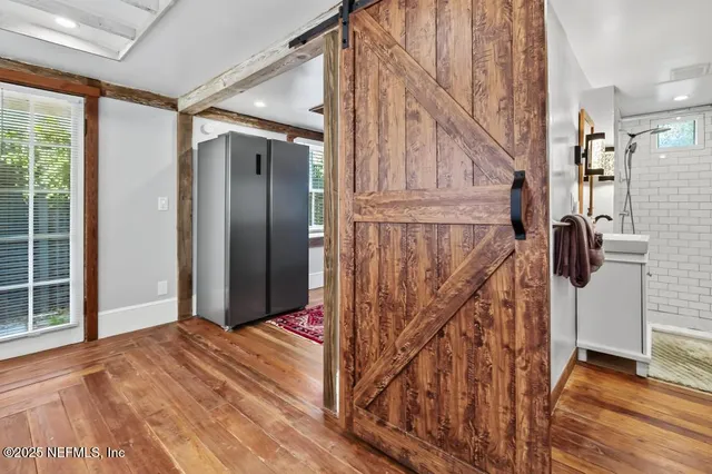 a kitchen with stainless steel appliances a sink and a refrigerator