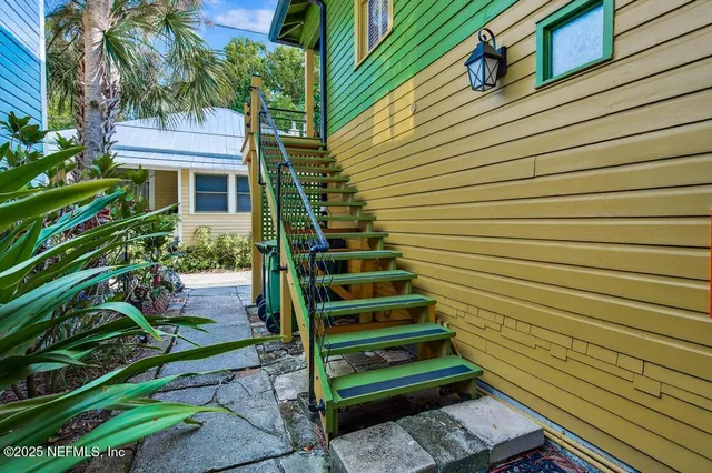 a bedroom with furniture and a flat screen tv