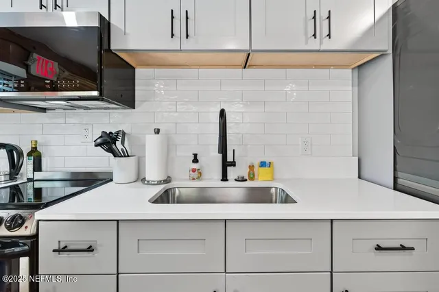 a bedroom with furniture and a flat screen tv