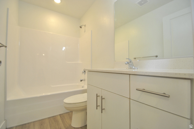 1219 West 1870 South Logan, UT 84321 - Photo 11 of 18 Full bath with vanity, bathtub / shower combination, light wood-type flooring, and recessed lighting