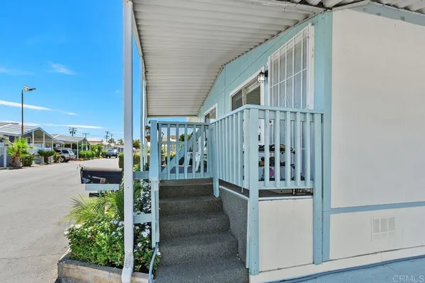 a balcony with chairs