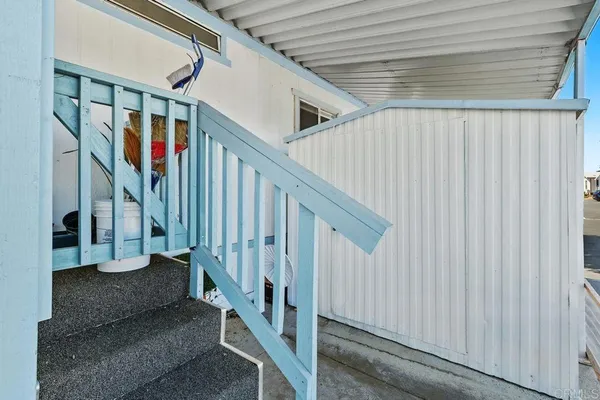 a view of staircase with white walls