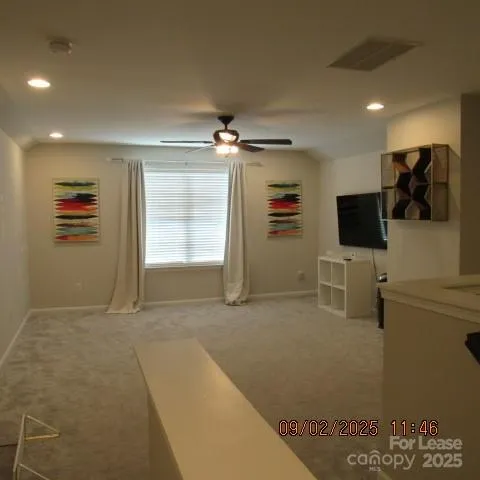 a view of a livingroom with furniture