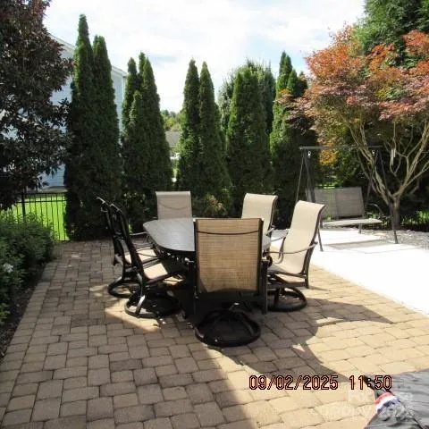 a view of backyard with sitting area