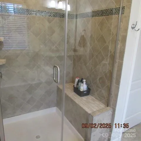 a bathroom with a sink and shower