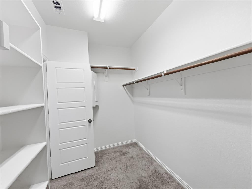 12632 Akenside Road Frisco, TX 75035 - Photo 27 of 40 a view of walk in closet