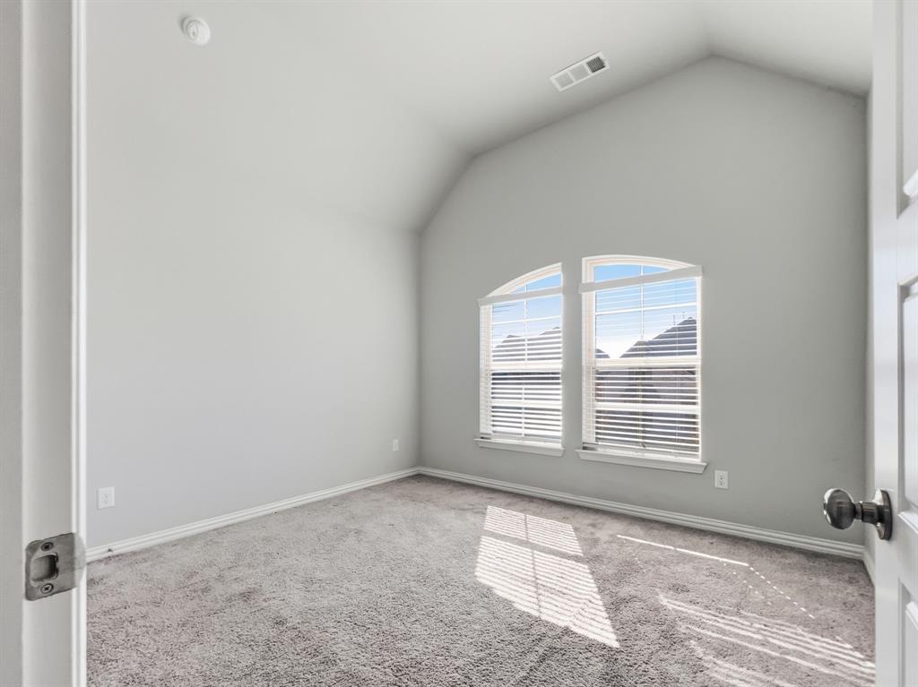 12632 Akenside Road Frisco, TX 75035 - Photo 31 of 40 an empty room with windows