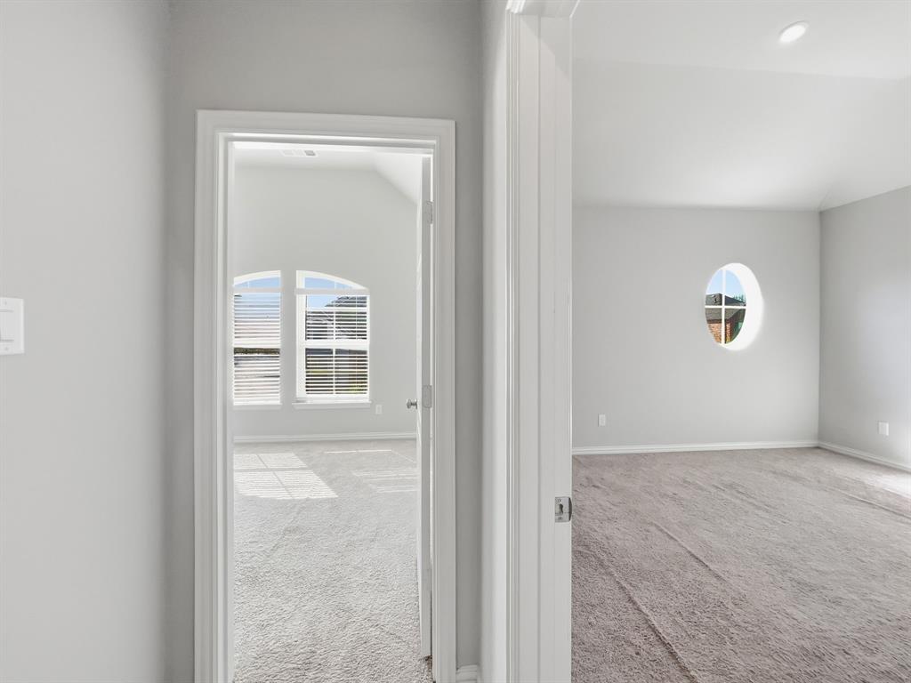 12632 Akenside Road Frisco, TX 75035 - Photo 32 of 40 an empty room with windows