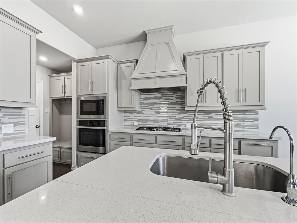 12632 Akenside Road Frisco, TX 75035 - Photo 8 of 40 Kitchen includes sink with a gooseneck faucet,