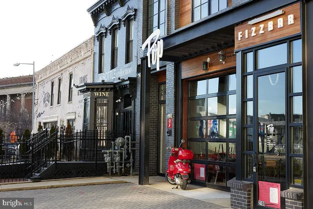 a view of a building with traffic signal lights