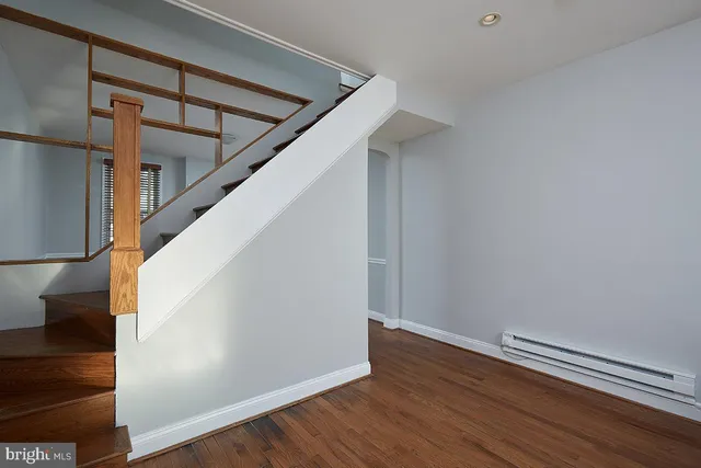 a view of entryway with wooden floor