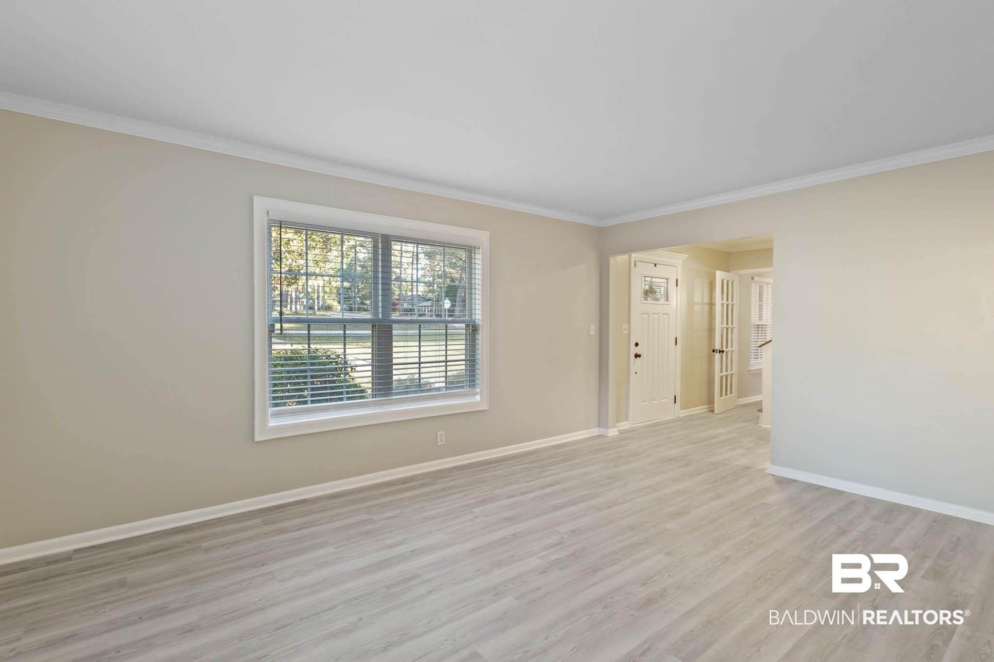 608 Southern Way Daphne, AL 36527 - Photo 5 of 35 Unfurnished room with light wood-style flooring and ornamental molding