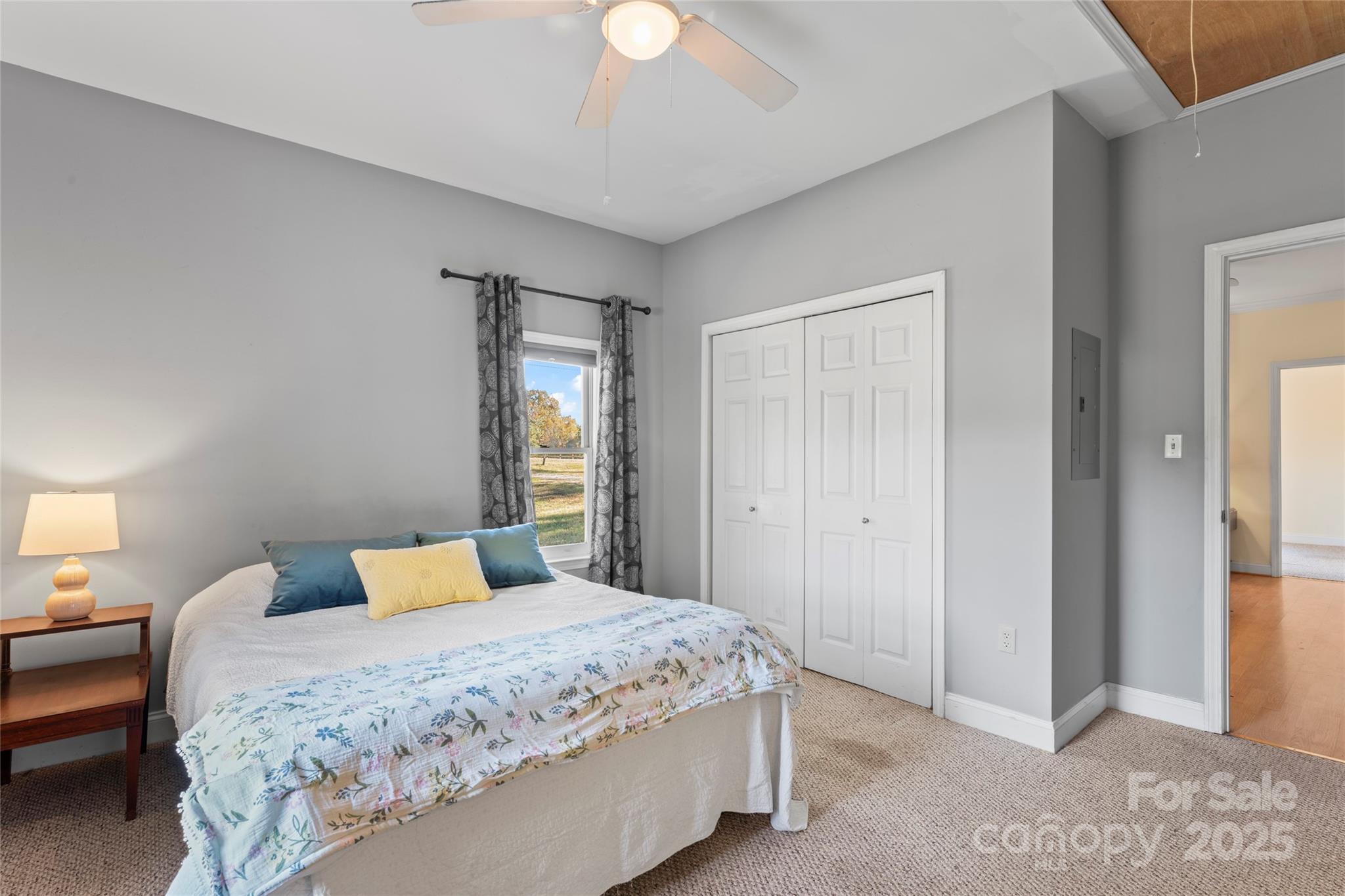 645 Chestnut Ridge Church Road Kings Mountain, NC 28086 - Photo 27 of 45 a bedroom with a bed and a chandelier