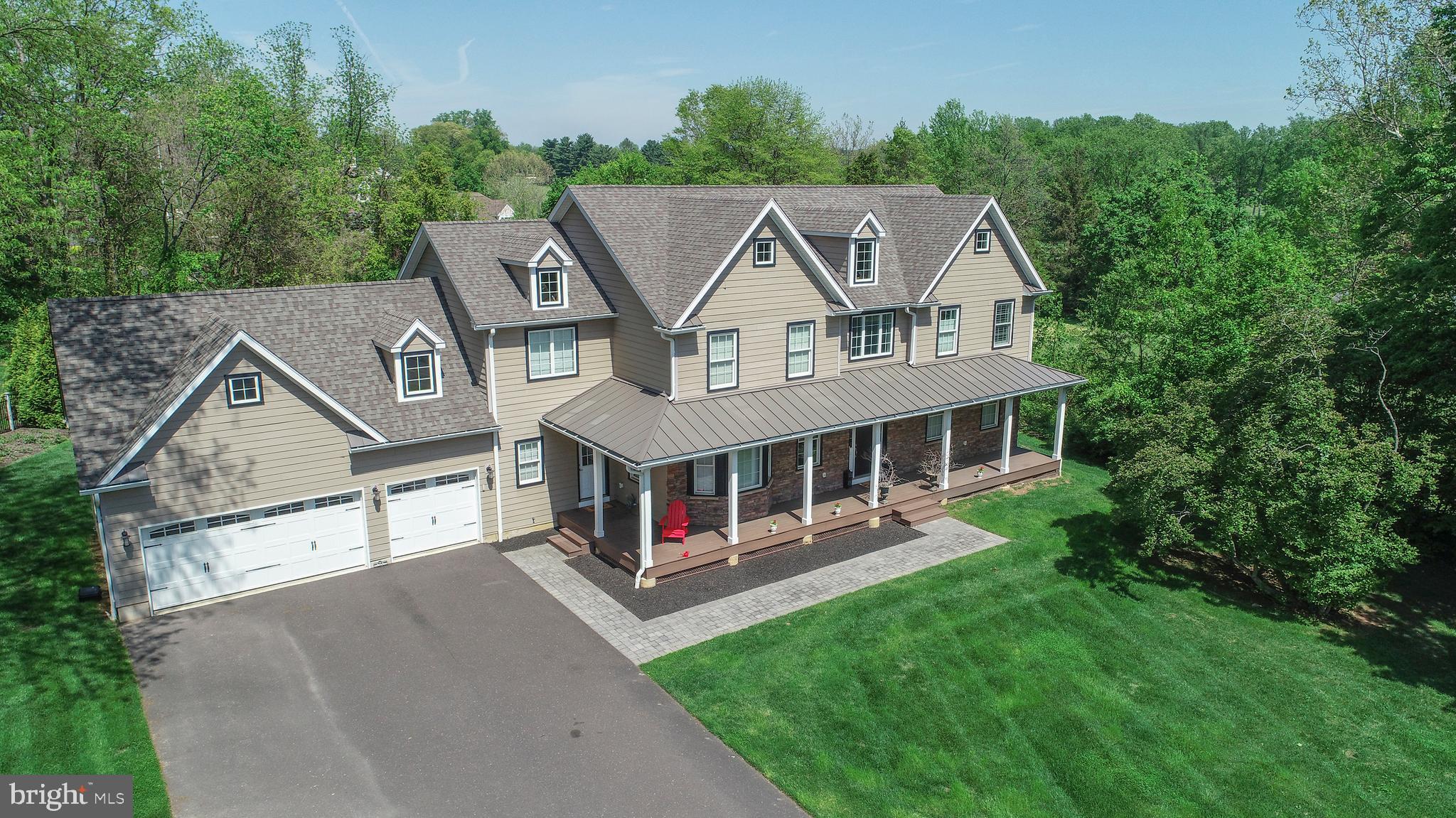 an aerial view of a house with a big yard