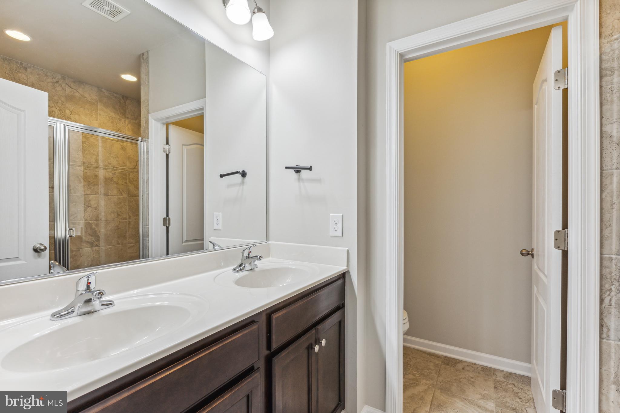 7845 Wormans Mill Road Frederick, MD 21701 - Photo 25 of 39 En Suite Bath w/ Water Closet and Double Vanity