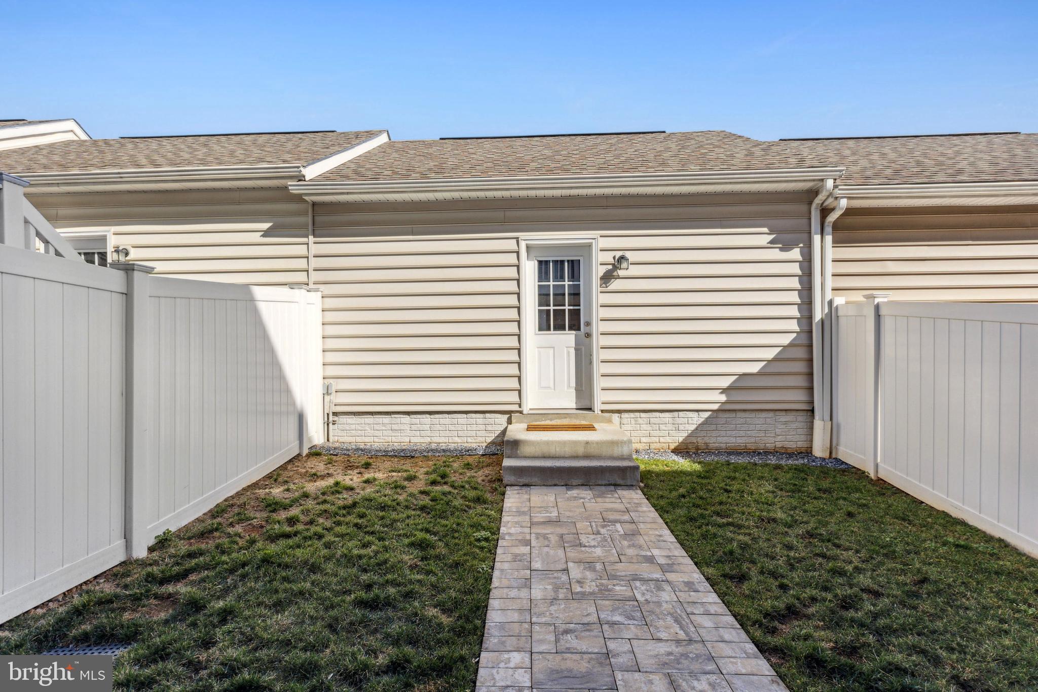 7845 Wormans Mill Road Frederick, MD 21701 - Photo 35 of 39 Fenced Back Yard Leading to Garage