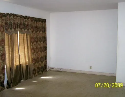 a kitchen that has a sink and a stove