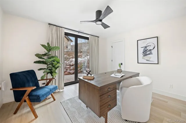 a room with pool table and windows