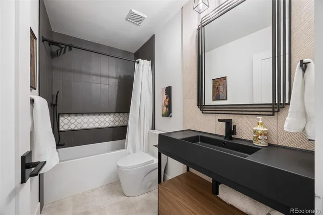 a bathroom with a double vanity sink and mirror