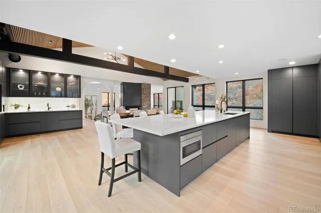a view of a storage & utility room with refrigerator