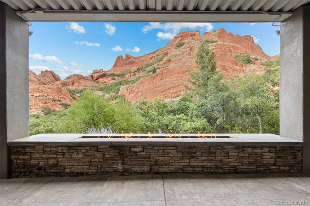 a backyard of a house with a garden and mountain view