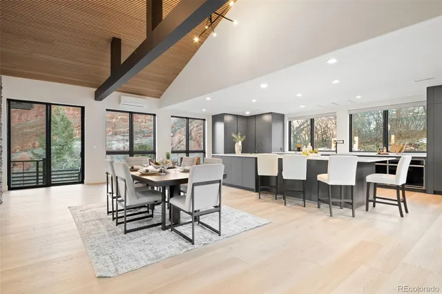 a living room with lots of furniture and a large window